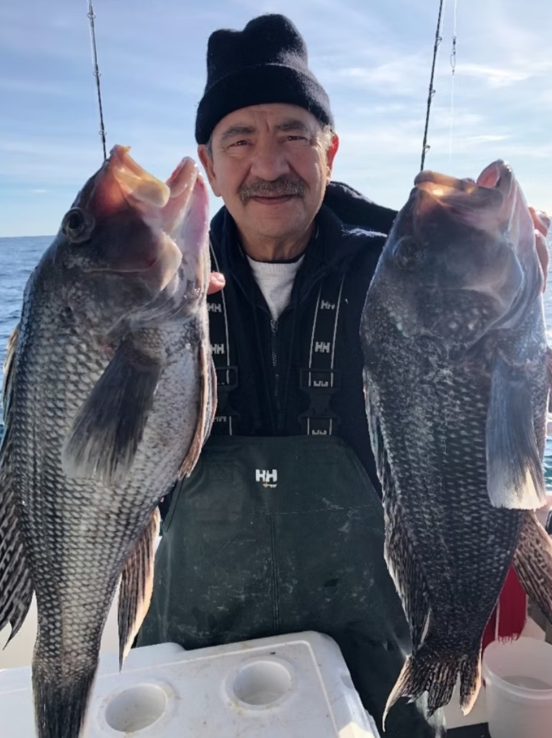Blackfish striped bass fishing Long Island — angler with tautog catch aboard Super Hawk near Point Lookout