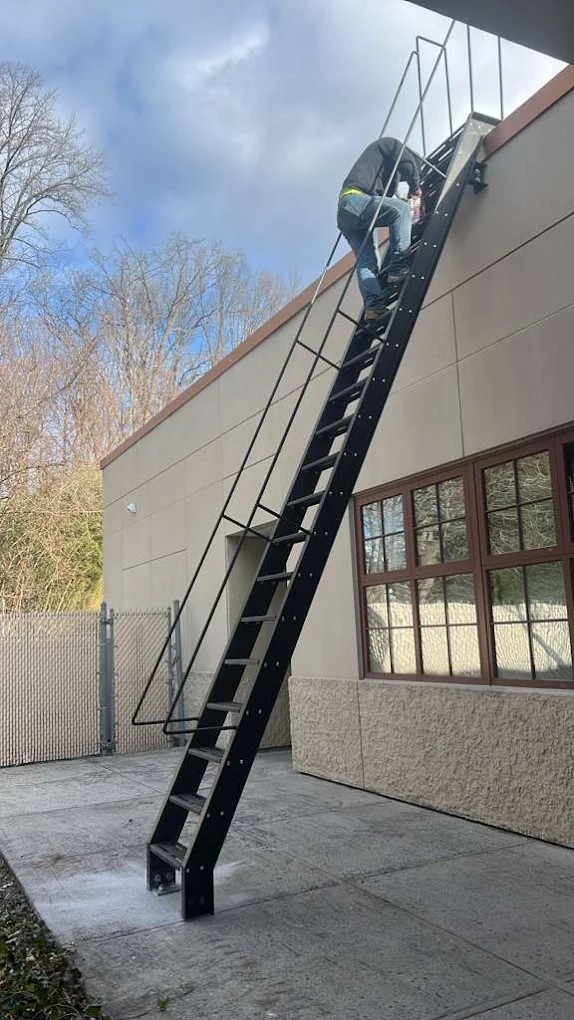 Custom sidewalk cellar door with serrated grating installed in Brooklyn, NY