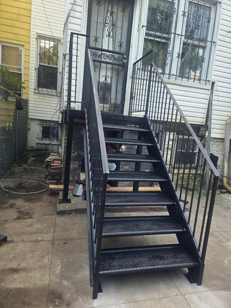 Economaster trash bin enclosure and rolldown security gate installed in Williamsburg, Brooklyn