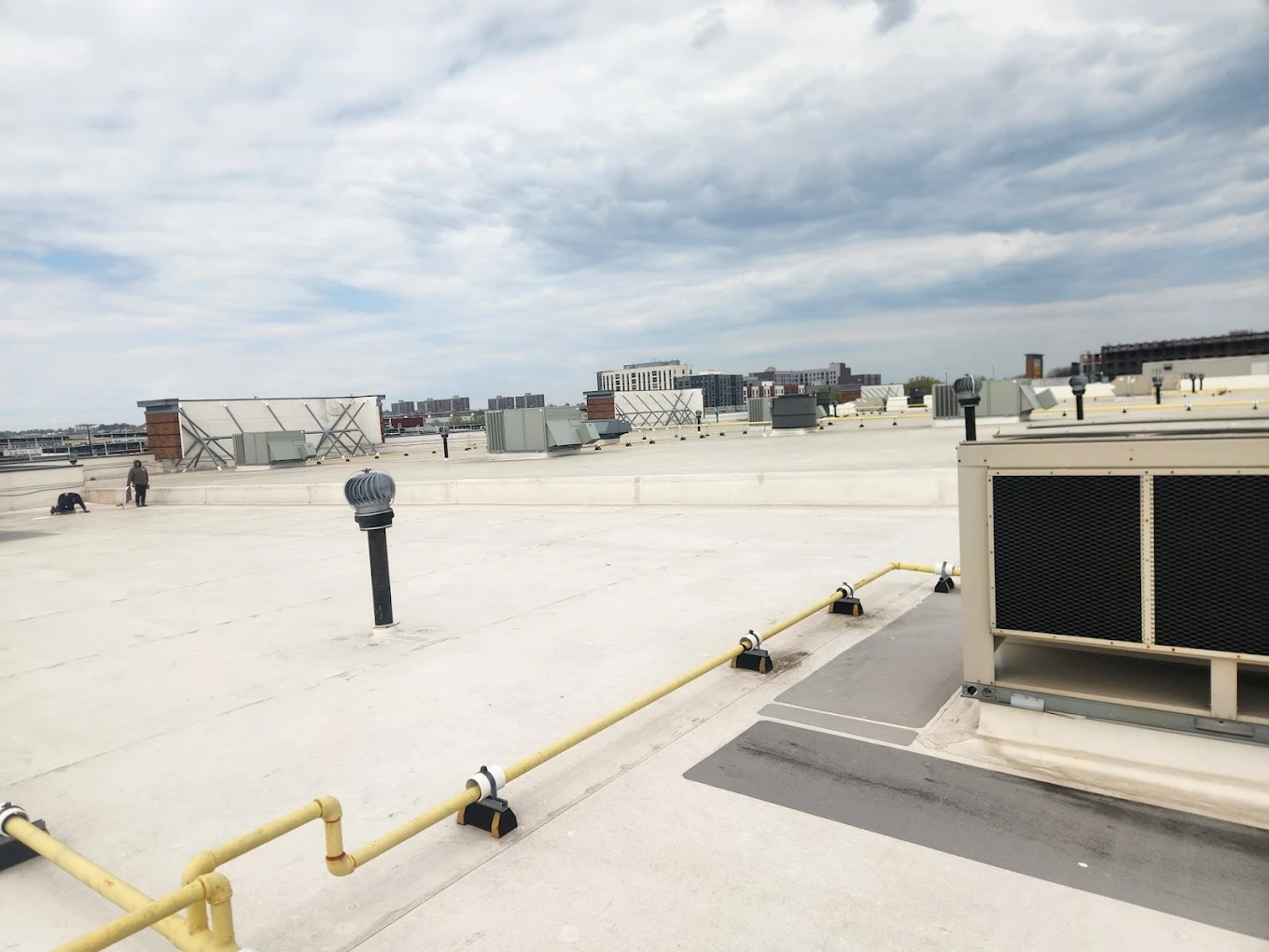 Commercial flat roof insulation and drainage system on industrial building near Bay Shore Long Island